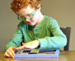 Boy using Cotter Abacus
